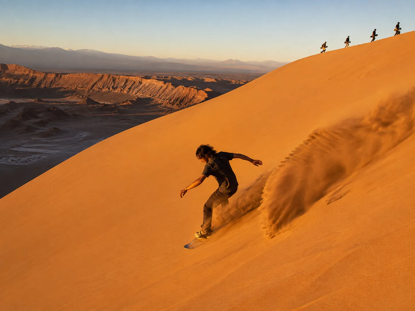 Sandboarding on Valle de la Muerte dunes